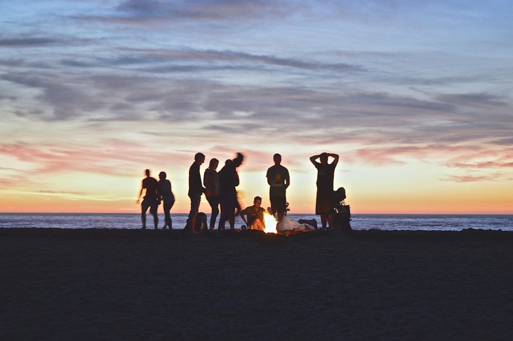 rent an island for a week, friends on an island beach