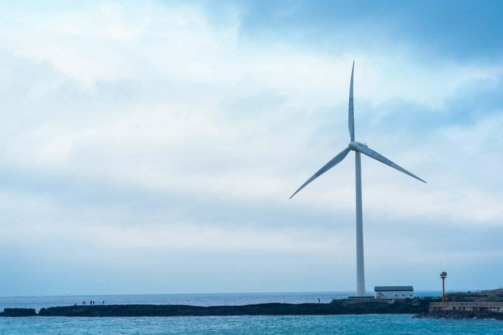 Wind turbine on a coastal site generating power for an island